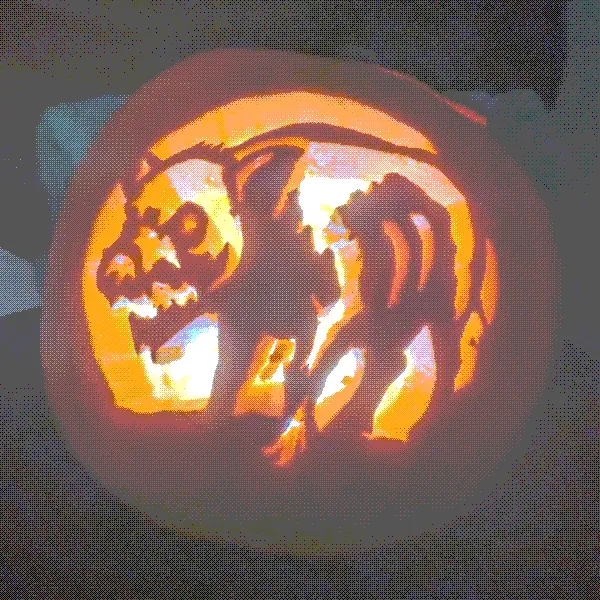 a pumpkin carving of a spooky zombie javelina - they're similar to pigs