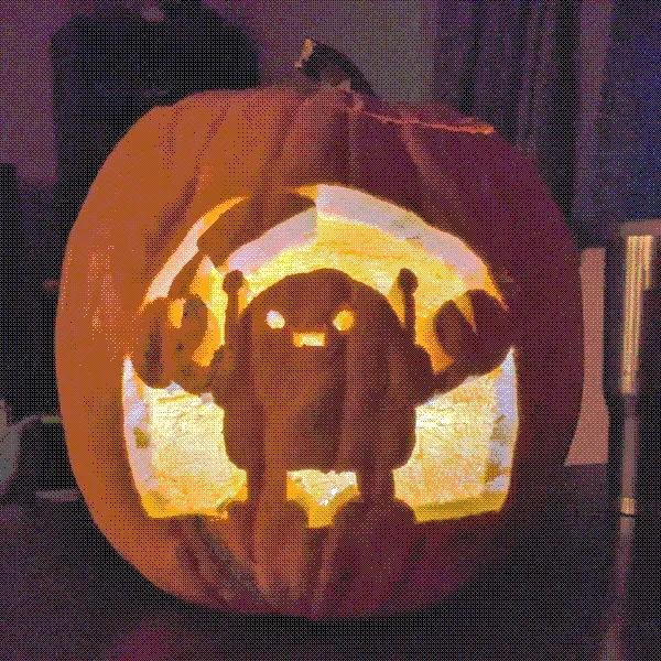 a pumpkin carving of a cute cartoon style robot